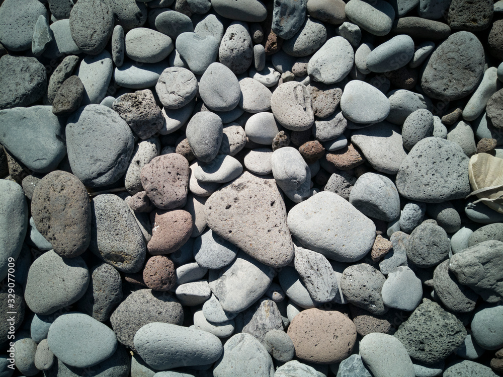 Stone pebbles texture or stone background with natural stones Stone pebbles texture or stone background with natural stones
