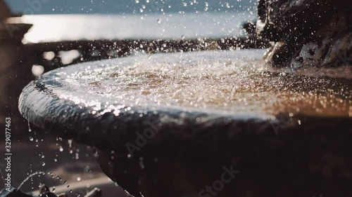 Wallpaper Mural Closeup of splashing water of old fountain on the mountain landscape background Torontodigital.ca