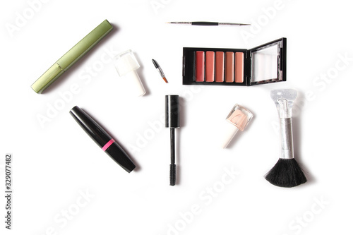 different female cosmetics on a white background