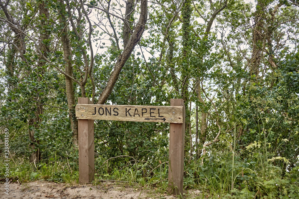 Jons Kapel, Bornholm island, Denmark - July 02, 2019. Trail to the Jons Kapel (John's Chapel) - a 22-metre high solitary rock which resembles a church tower, Bornholm island, Denmark Jons Kapel, Bornholm island, Denmark - July 02, 2019. Trail to the Jons Kapel (John's Chapel) - a 22-metre high solitary rock which resembles a church tower, Bornholm island, Denmark