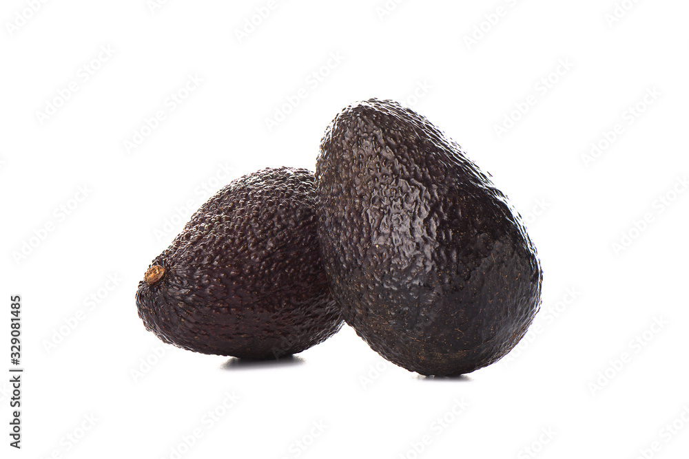 Two haas avocado fruits isolated over the white background. Two haas avocado fruits isolated over the white background.