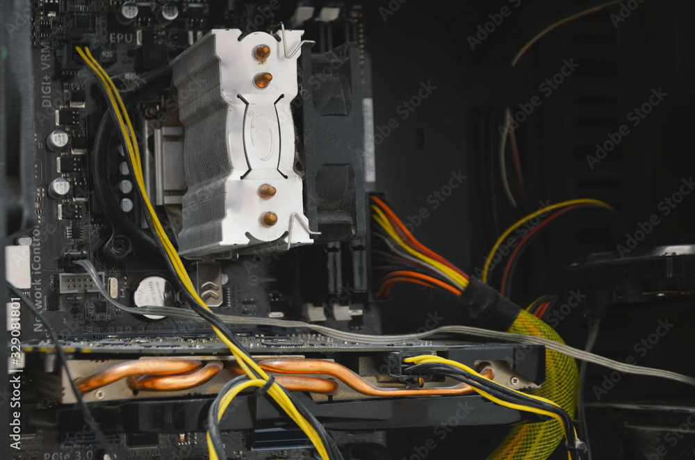 Computer or server board crammed with wires inside. System unit with a