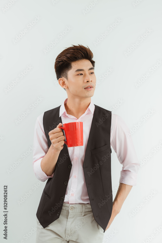 Portrait Handsome Asian boy holding coffee cup over white background Portrait Handsome Asian boy holding coffee cup over white background