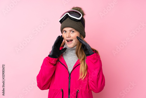 Ukrainian teenager skier girl with snowboarding glasses over isolated pink background shouting with mouth wide open
