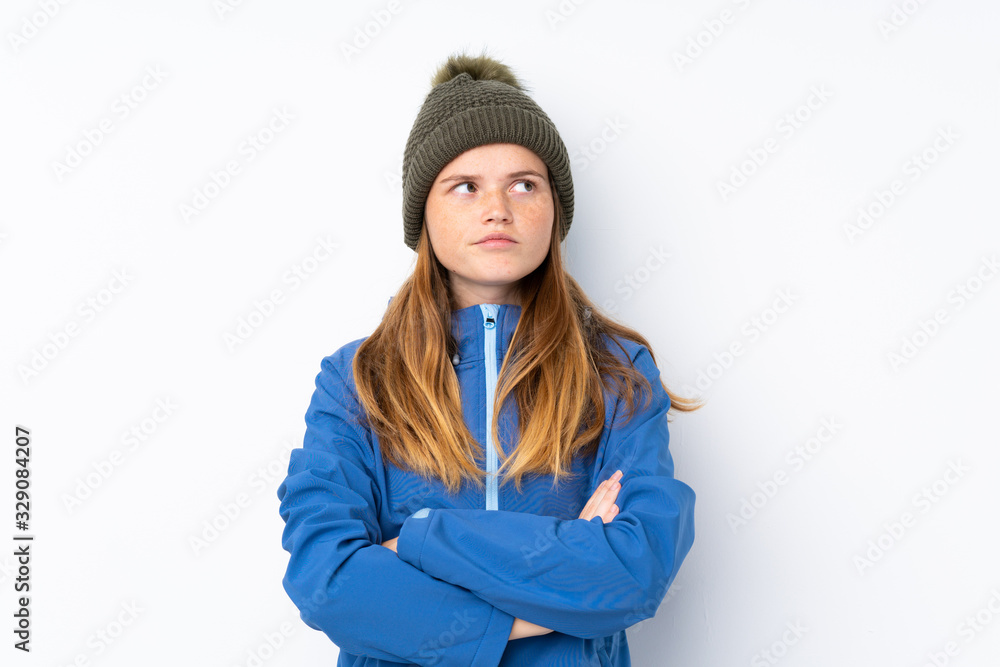 Ukrainian teenager girl with winter hat over isolated white background thinking an idea Ukrainian teenager girl with winter hat over isolated white background thinking an idea