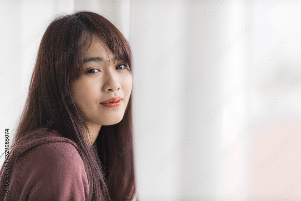 Portrait of beautiful young Asian woman is smiling in bed. Portrait of beautiful young Asian woman is smiling in bed.