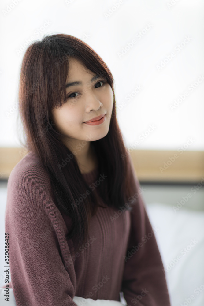 Portrait of beautiful young Asian woman is smiling in bed. Portrait of beautiful young Asian woman is smiling in bed.