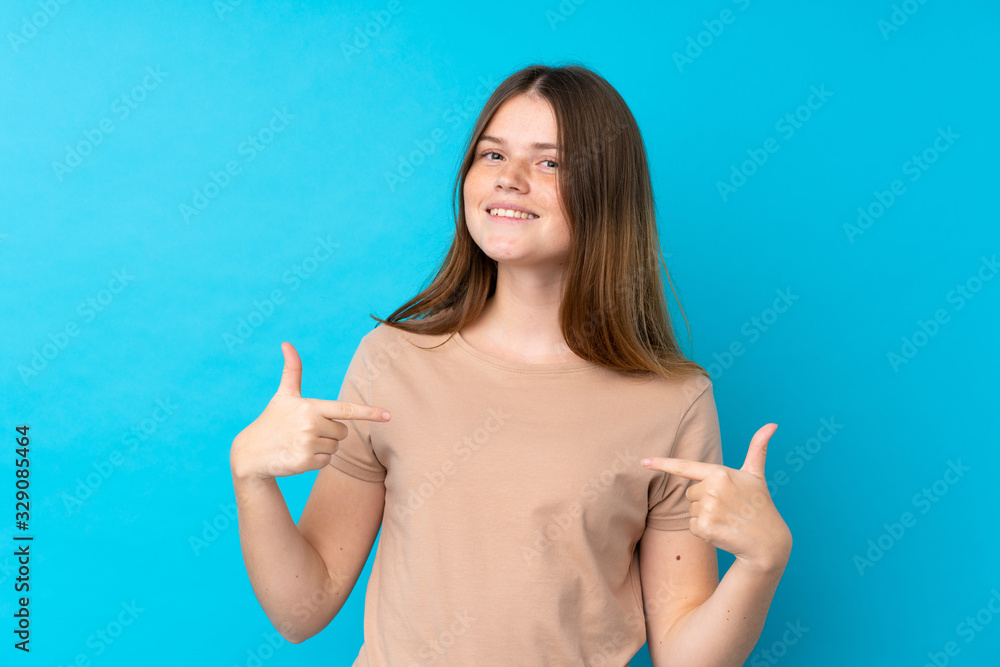 Ukrainian teenager girl over isolated blue background proud and self-satisfied Ukrainian teenager girl over isolated blue background proud and self-satisfied