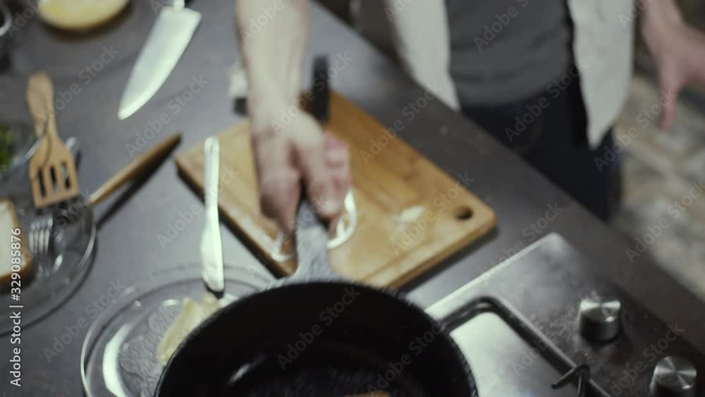 Making toasted bread on pan, flipping in the air, slow motion, shallow depth of field Making toasted bread on pan, flipping in the air, slow motion, shallow depth of field