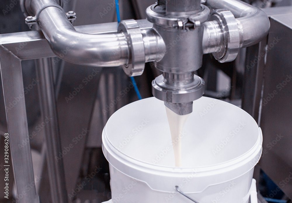 Production of condensed milk on an industrial scale. Condensed milk production in the