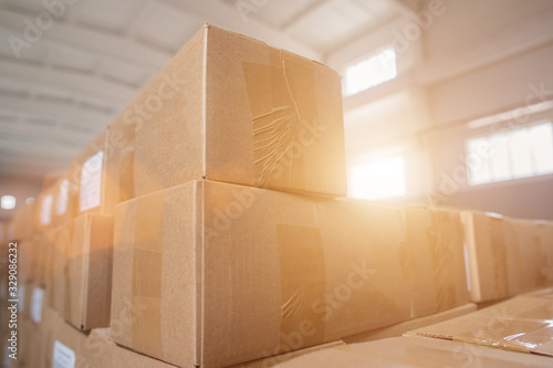Parcels and parcels in cardboard boxes at the customs control warehouse. The concept of excess prices for parcels from abroad, the limit on parcels, postal items photo