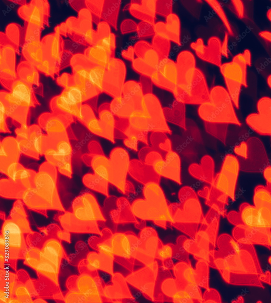 Fantasy abstract picture with lilac blurred hearts on the dark background Fantasy abstract picture with lilac blurred hearts on the dark background