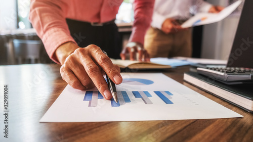 Wallpaper Mural Business team brainstorming and discussing with financial data and report graph. Teamwork meeting working concept. Torontodigital.ca