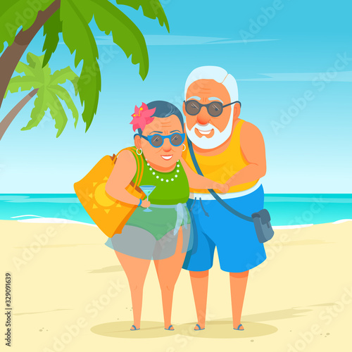 An active happy elderly tourist couple standing on beach sand. Summer sunny day at the resort. Cute funny grandma and grandpa. A cartoon senior adult in swimwear. Sea on the background.