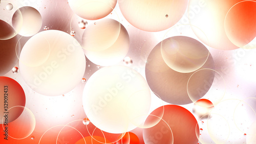 bright oily drops in water with colorful background, close-up 