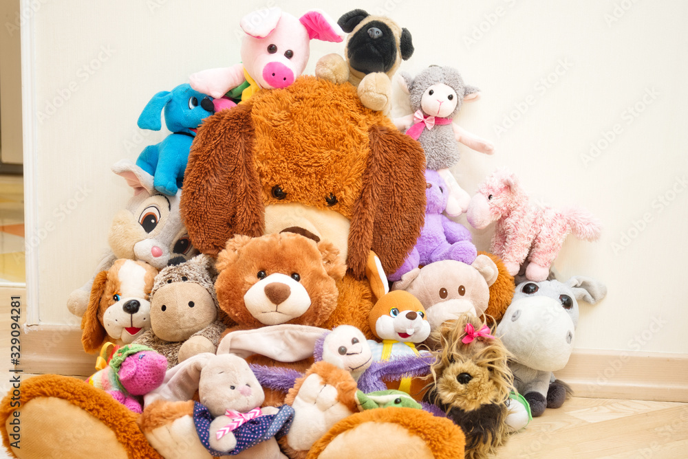 Many Soft plush fluffy toys sits in the children's room Many Soft plush fluffy toys sits in the children's room