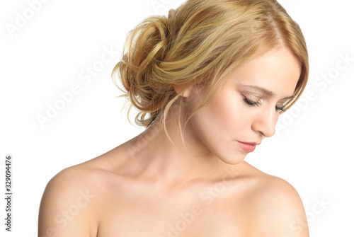 Portrait of beautiful woman with blonde hair on white background