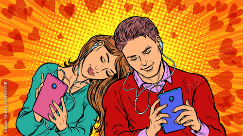 A couple in love, a young man and a girl are chatting on social networks by phone