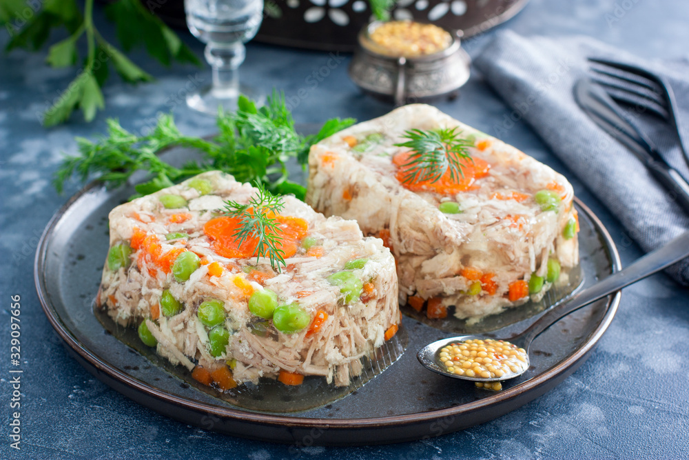 Homemade jelly with chicken, pork peas with slices of carrots, horizontal Homemade jelly with chicken, pork peas with slices of carrots, horizontal