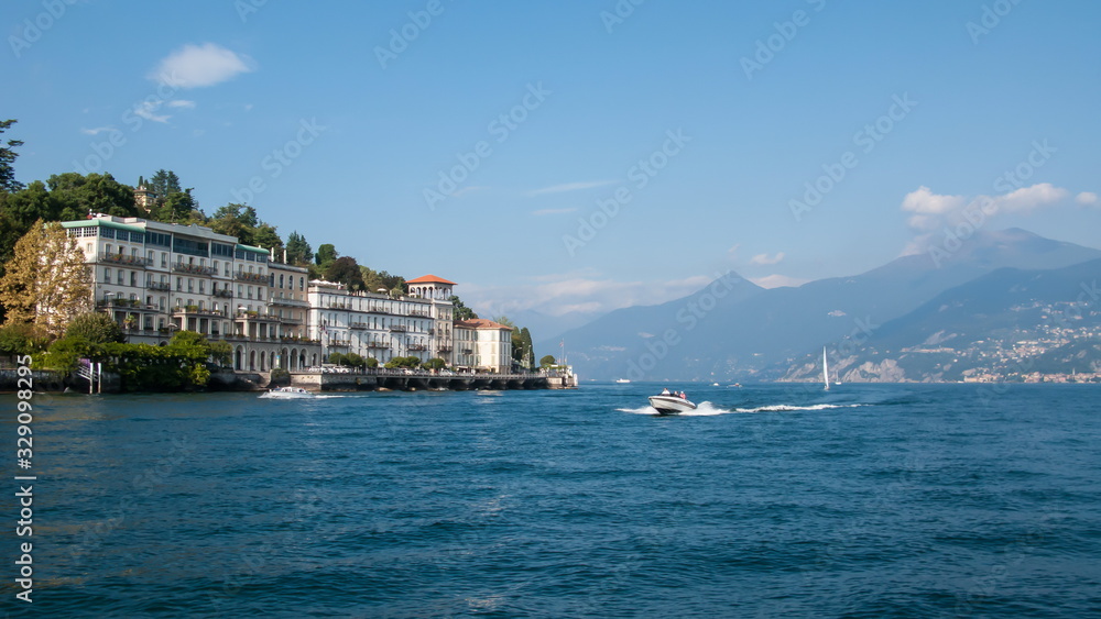panoramic view of lake como and mountains on a sunny day