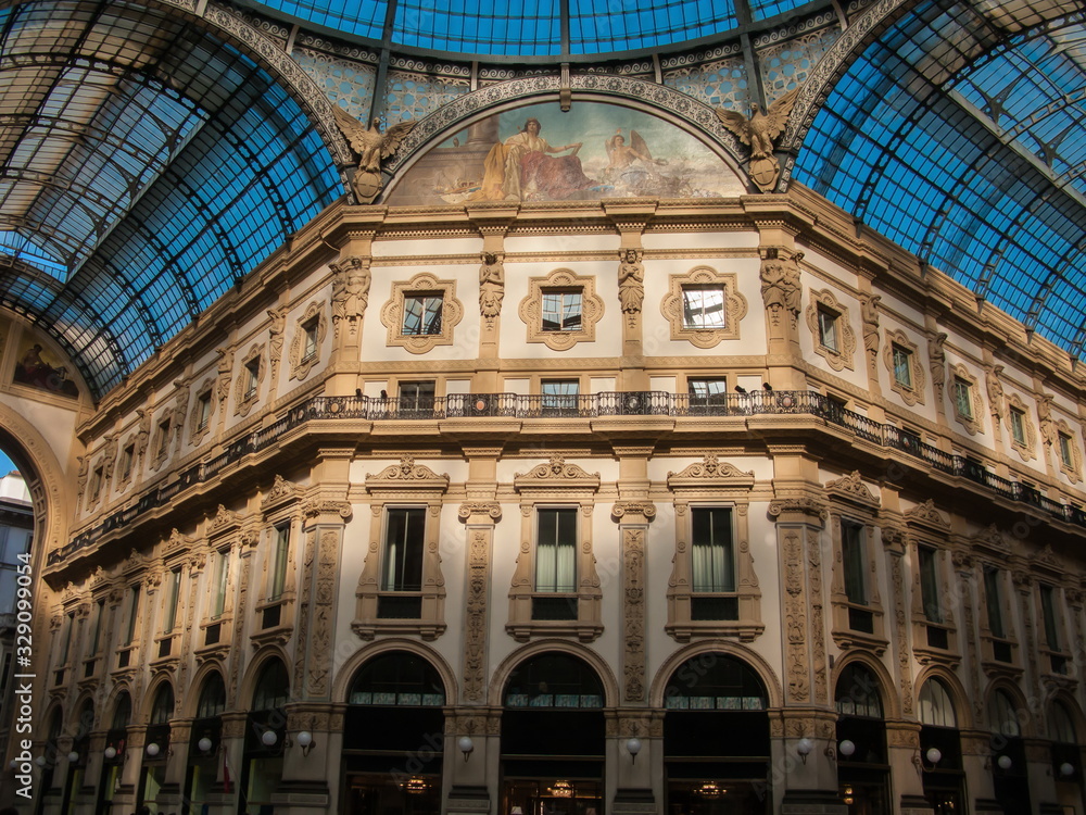 murals, walls, glass arched roof and blue sky of Galleria Vittorio Emanuele II, Milan, Lombardy, Italy murals, walls, glass arched roof and blue sky of Galleria Vittorio Emanuele II, Milan, Lombardy, Italy