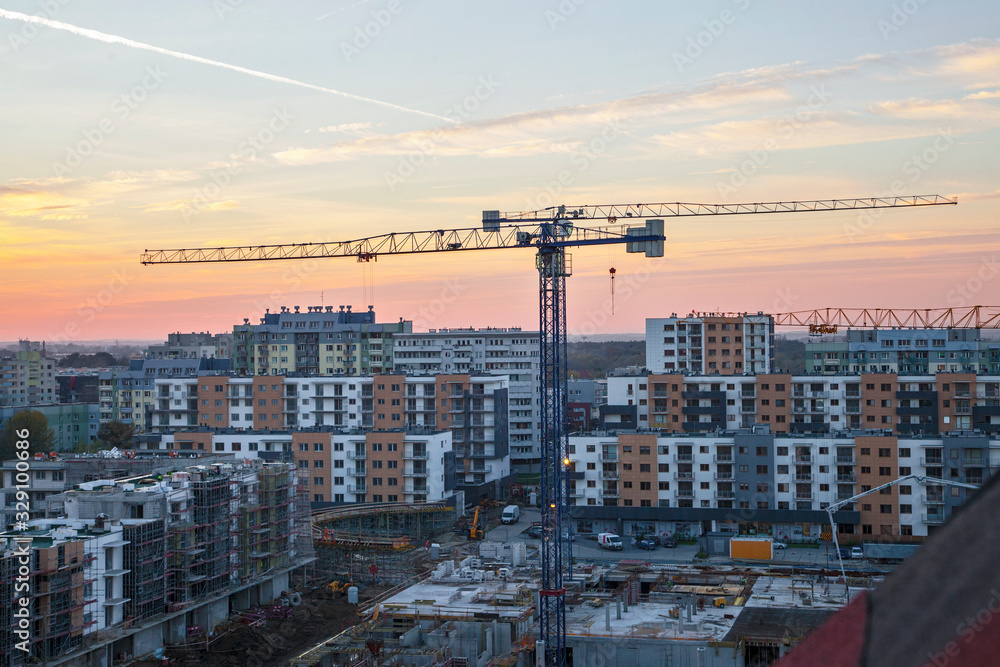 Naklejka premium crane lift works on demolition of brutal reinforced concrete plate build biulding