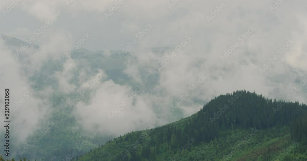 beautiful landscape of mountains take off after rain. Steam emerges from the slopes of the mountains. Time lapse. 4k beautiful landscape of mountains take off after rain. Steam emerges from the slopes of the mountains. Time lapse. 4k