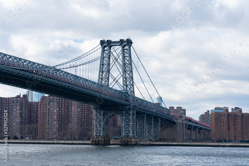 The Williamsburg Bridge over the East River with a view of the Lower East Side of New York City