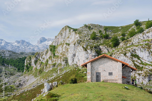Cabin surrounded by mountains in the Picos de Europa Regional Park, Asturias, Spain