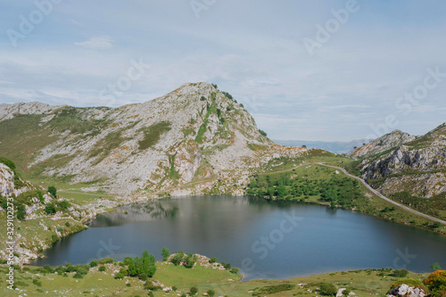 Amazing landscape of tranquil lake between rocky mountains in sunny day in Spain