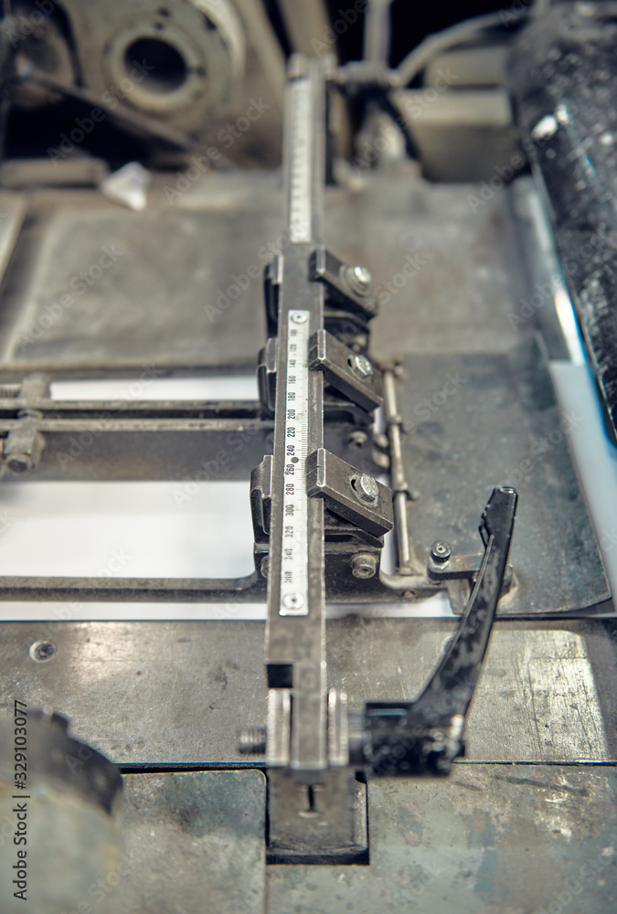 A industrial commercial envelope making machine, making paper envelopes for international distribution. Automated engineering machinery for mass production of paper envelopes. A industrial commercial envelope making machine, making paper envelopes for international distribution. Automated engineering machinery for mass production of paper envelopes.