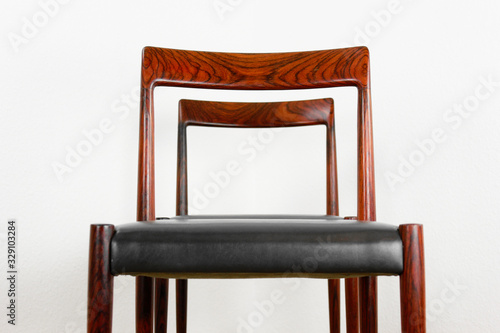 2x danish rosewood CHAIR Danish Design Chairs Mid Century 60s Vintage Dining leather seat wood Modern antique 50s 70s retro original isolated on white wall in modern living room closeup loft