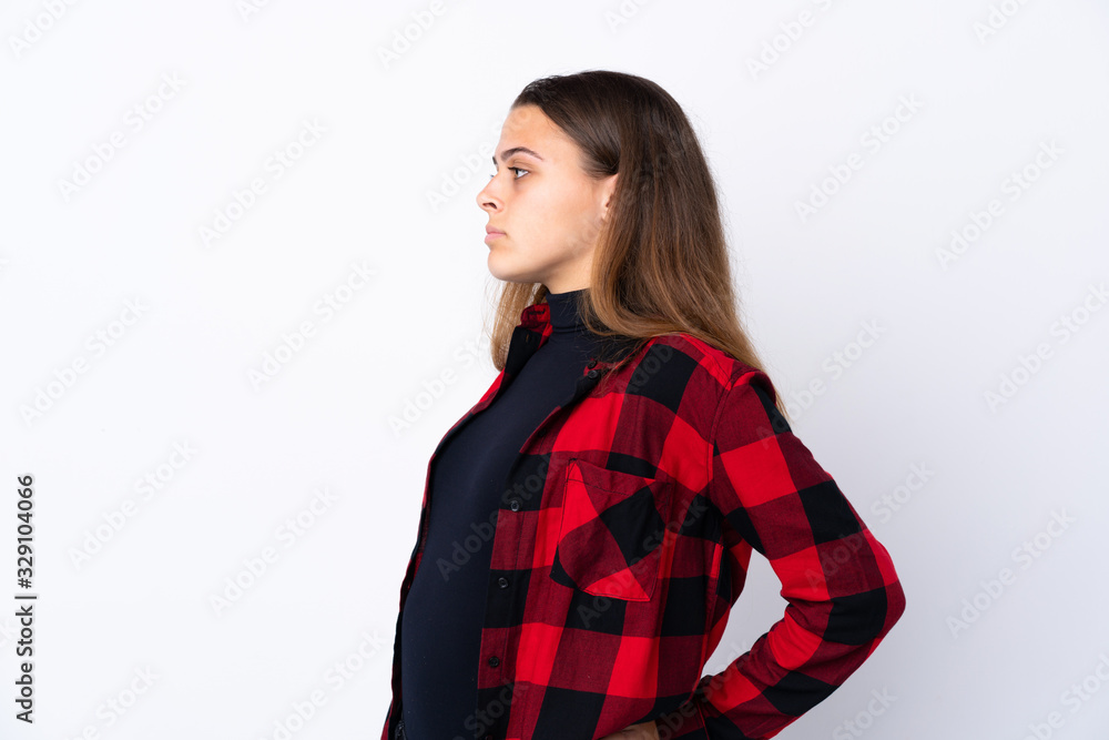 Teenager girl over isolated white background suffering from backache for having made an effort Teenager girl over isolated white background suffering from backache for having made an effort