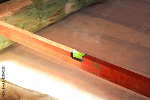 red level lying on the logs. work on installing the floor