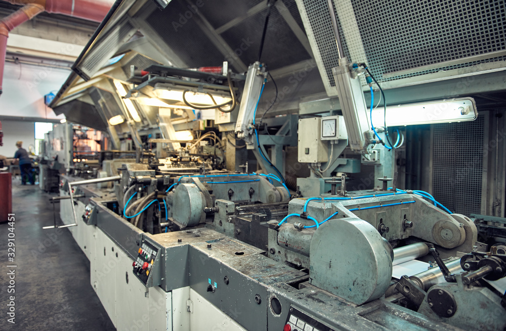 A industrial commercial envelope making machine, making paper envelopes for international distribution. Automated engineering machinery for mass production of paper envelopes. A industrial commercial envelope making machine, making paper envelopes for international distribution. Automated engineering machinery for mass production of paper envelopes.