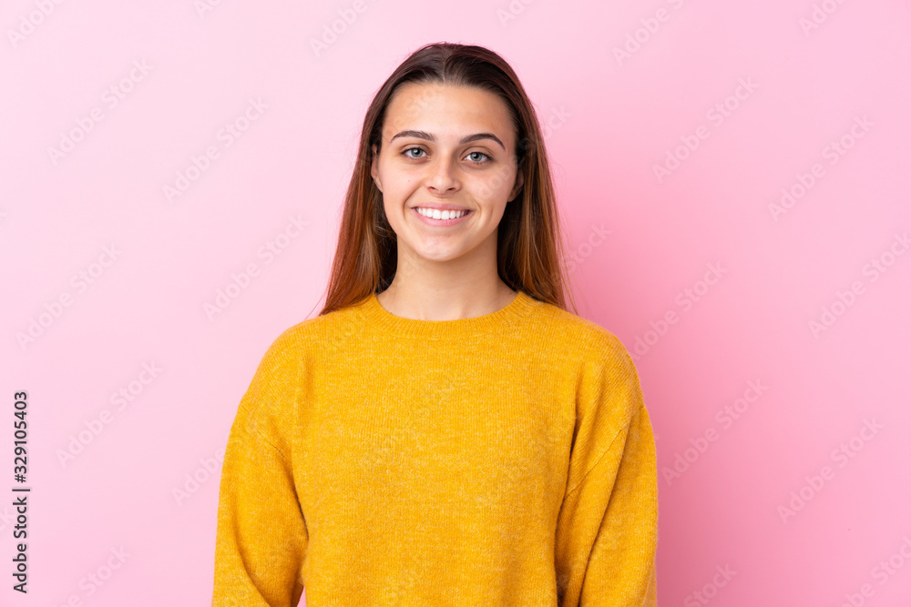 Teenager girl with yellow sweater over isolated pink background laughing Teenager girl with yellow sweater over isolated pink background laughing