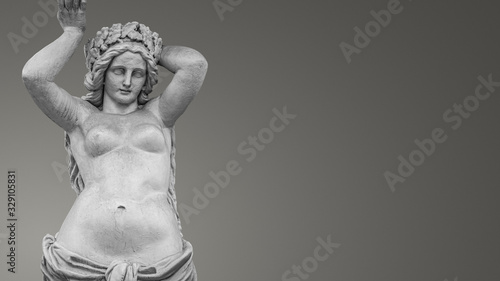 Banner with a portrait of young and naked sensual Roman Italian Renaissance Era woman statue with copy space for text and gradient grey background, details, closeup