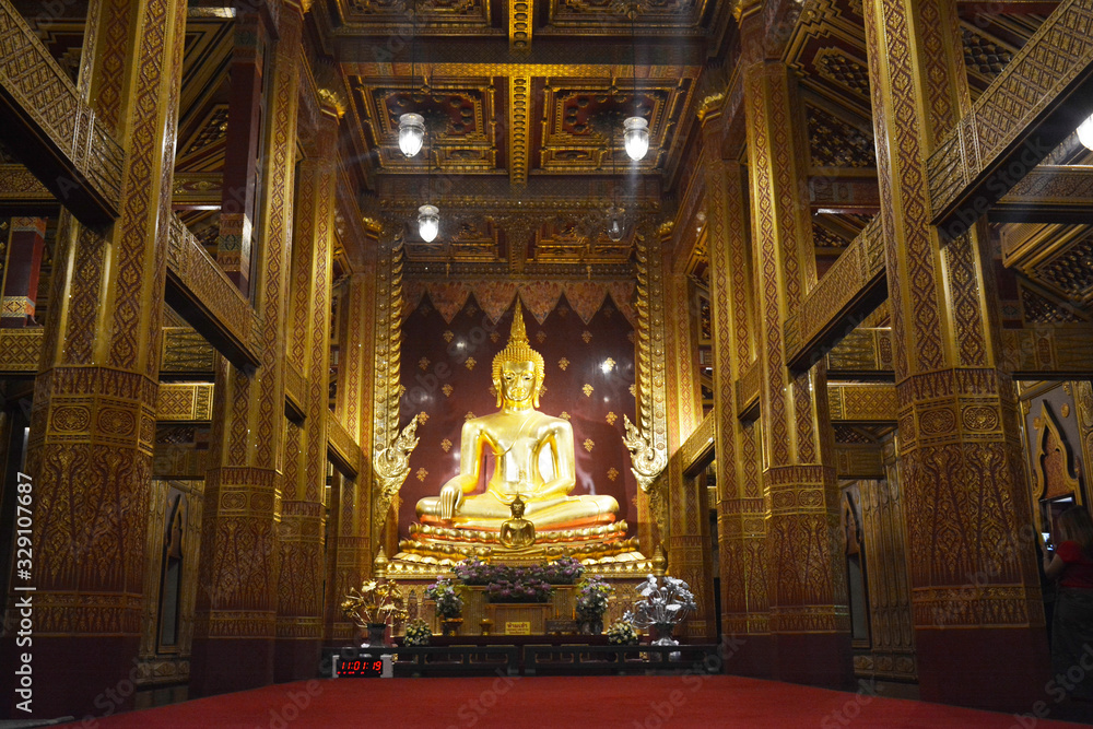 Buddha's statue in golden building at Mae Sot, Thailand