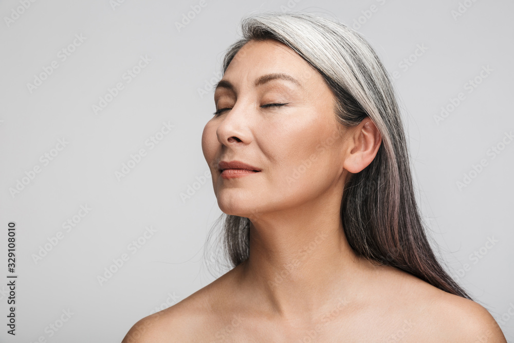 Beauty portrait of an attractive mature topless woman