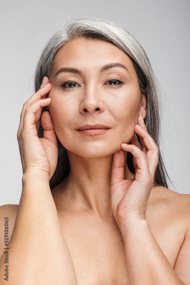 Beauty portrait of an attractive mature topless woman Beauty portrait of an attractive mature topless woman