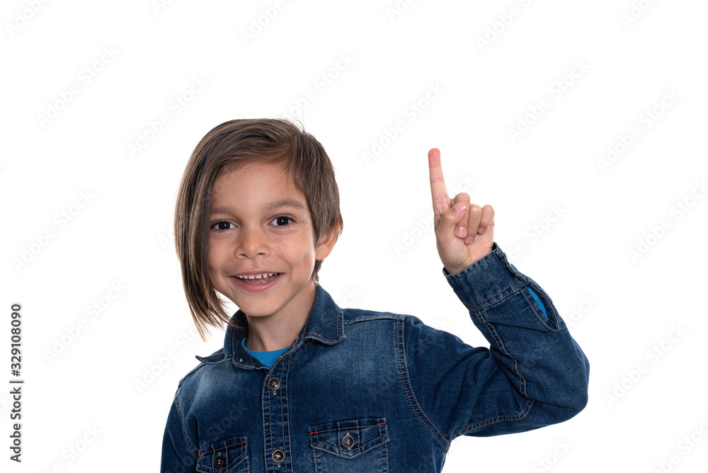 Little boy looking at camera and pointing with hand Little boy looking at camera and pointing with hand