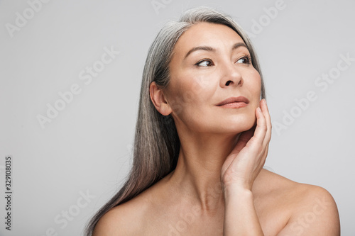 Bild auf Leinwand Beauty portrait of an attractive mature topless woman