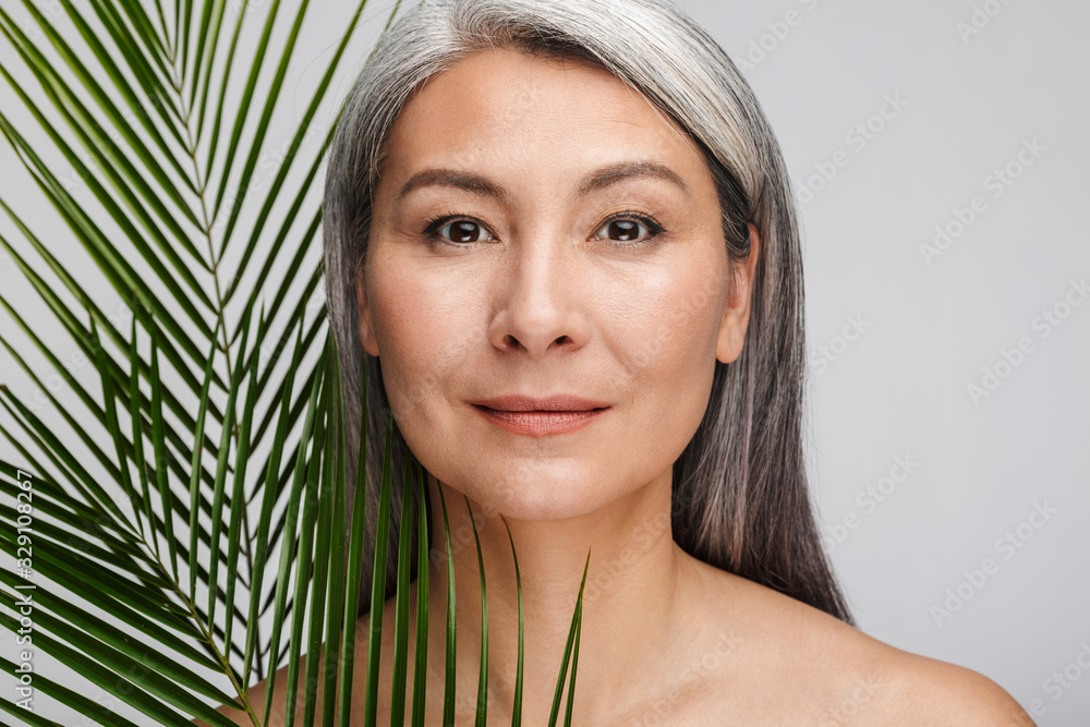 Beauty portrait of an attractive mature topless woman Beauty portrait of an attractive mature topless woman
