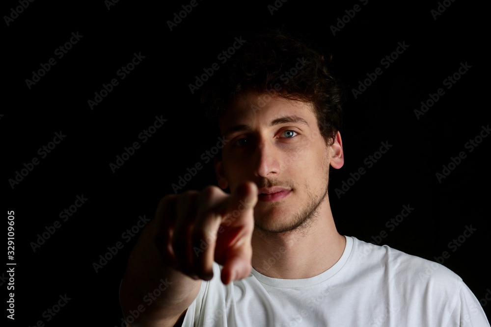 serious guy indicating on camera with finger serious guy indicating on camera with finger