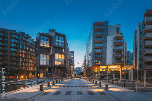Oslo, Norway. Night View Of Residential Multi-storey Houses In Aker Brygge District. Summer Evening. Residential Area. Famous And Popular Place photo