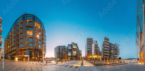 Oslo, Norway. Night View Of Residential Multi-storey Houses In Aker Brygge District. Summer Evening. Residential Area. Famous And Popular Place. Panorama. © Grigory Bruev