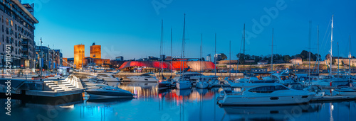 Fototapeta Oslo, Norway. Night View Embankment, Oslo City Hall And Moored Yachts Near Aker Brygge District. Summer Evening. Famous And Popular Place