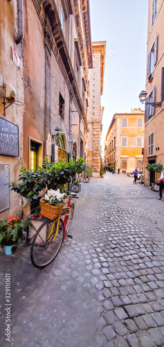Fototapeta Naklejka Na Ścianę i Meble -  ROME, ITALY - February 7, 2020:  The cobbled streets.  Old street in Rome, Italy. street view. Architecture and landmark of Rome