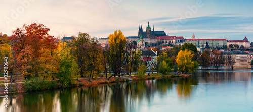 Prague autumn landscape. Prague autumn landscape view to Saint Vitus cathedral. Prague. Prague panorama. Prague  Czech Republic. Scenic autumn aerial view of the Old Town with red foliage. Czechia.