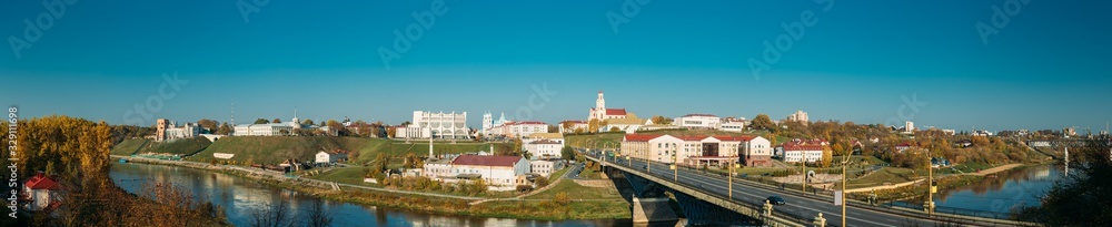 Grodno, Belarus. Grodno Regional Drama Theater And Catholic Church Of Discovery Of Holy Cross And Bernardine Monastery In Sunny Autumn Day. Panorama, Panoramic View. Skyline Cityscape